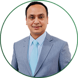 Dipesh Bista, Co-Founder & CGSO, in a light suit and tie.